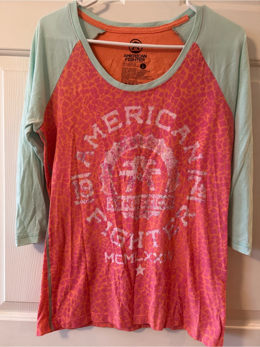 American Fighter Women’s Pink Coral Raglan Graphic Top